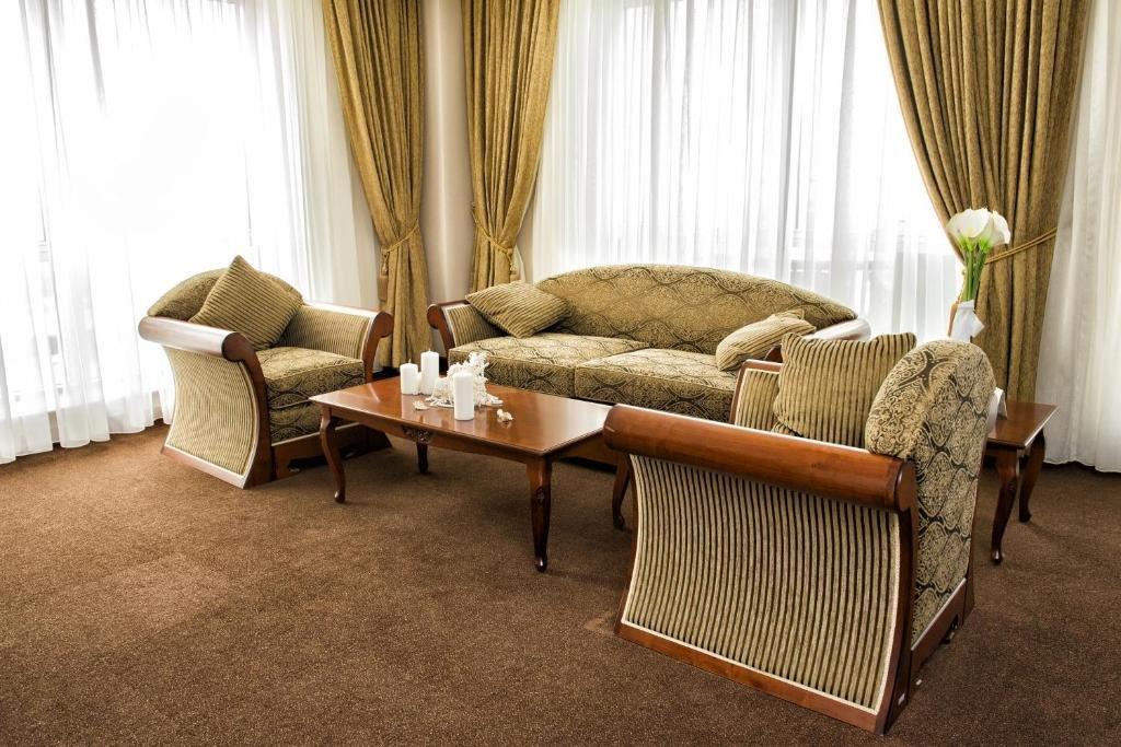 Caspian Riviera Grand Palace Hotel Aktau  Exterior photo A living room with carpet flooring